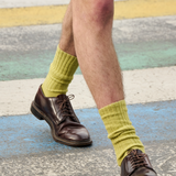 Man wearing cumin ribbed crew socks by Escuyer, made in Portugal