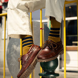 Man wearing Escuyer men's striped crew socks, made in Portugal