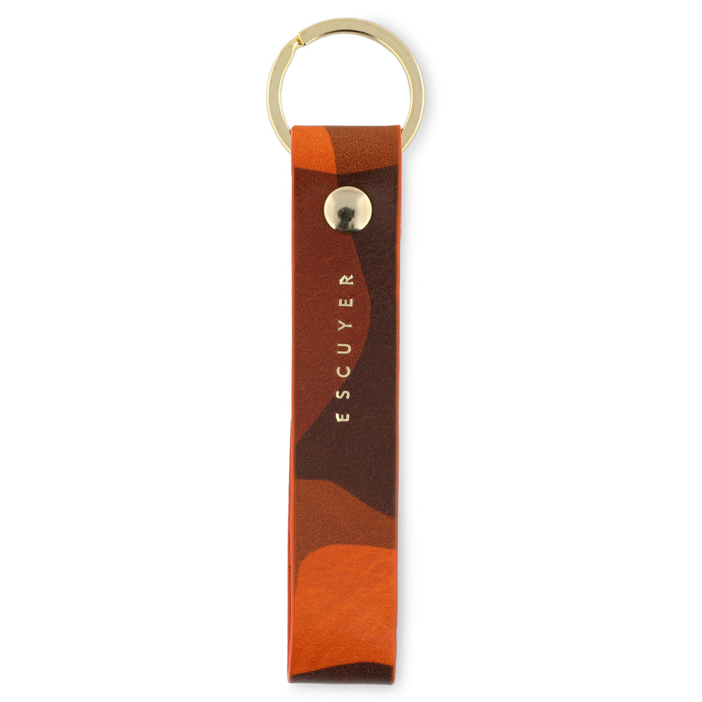 Escuyer orange camouflage leather keychain — hand-dyed Italian veg-tan tab with gold metal ring, handmade in Portugal