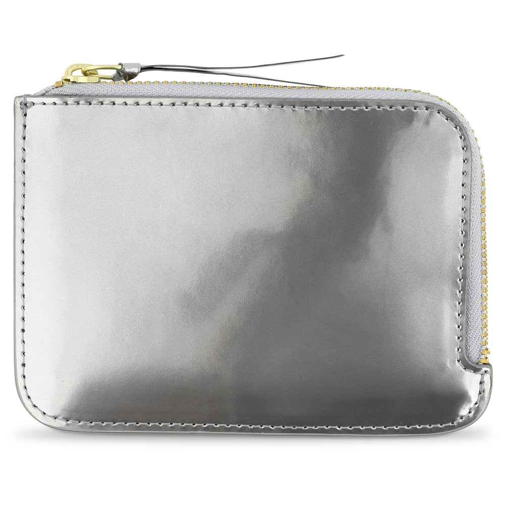 Escuyer Argent Métallisé zip wallet — iridescent metallic leather, shifts silver to gold in light