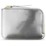 Escuyer Argent Métallisé zip wallet — iridescent metallic leather, shifts silver to gold in light