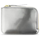 Escuyer Argent Métallisé zip wallet — iridescent metallic leather, shifts silver to gold in light