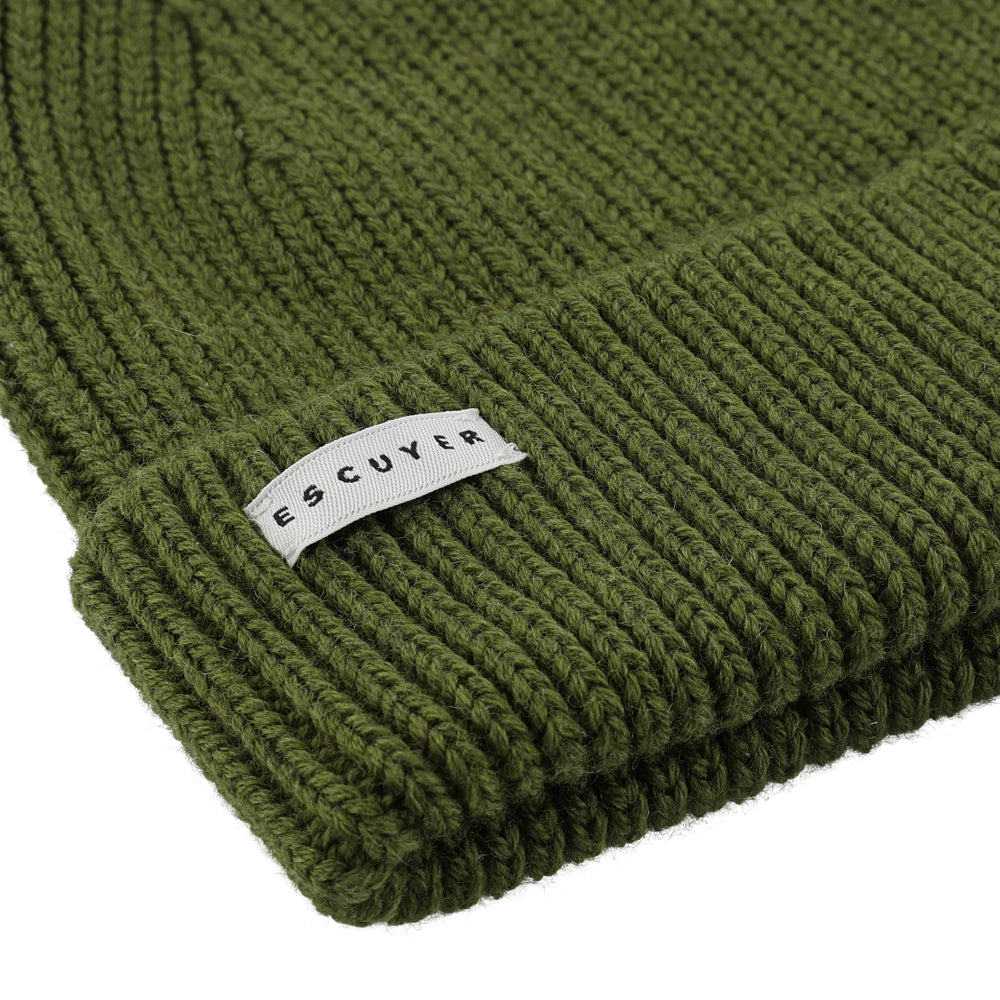 Side view of vert de gris ribbed merino wool beanie with folded cuff