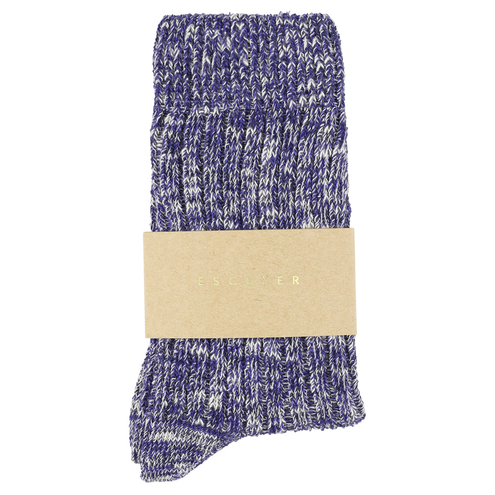 Blue and white patterned sock with a beige label on a white background