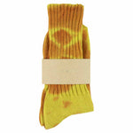 One-of-a-kind women's tie dye crew socks in rust and yellow, hand-dyed, made in Portugal by Escuyer