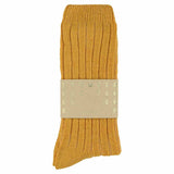 Close-up of Escuyer Mustard cashmere crew socks showing soft knit texture — 10% cashmere, 38% virgin wool, GRS certified recycled polyamide