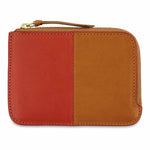 Escuyer orange and mustard zip wallet showing vertical colour-block split and zip closure