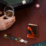 Escuyer camouflage slim leather wallet lifestyle — hand-dyed Italian veg-tan, made in Portugal