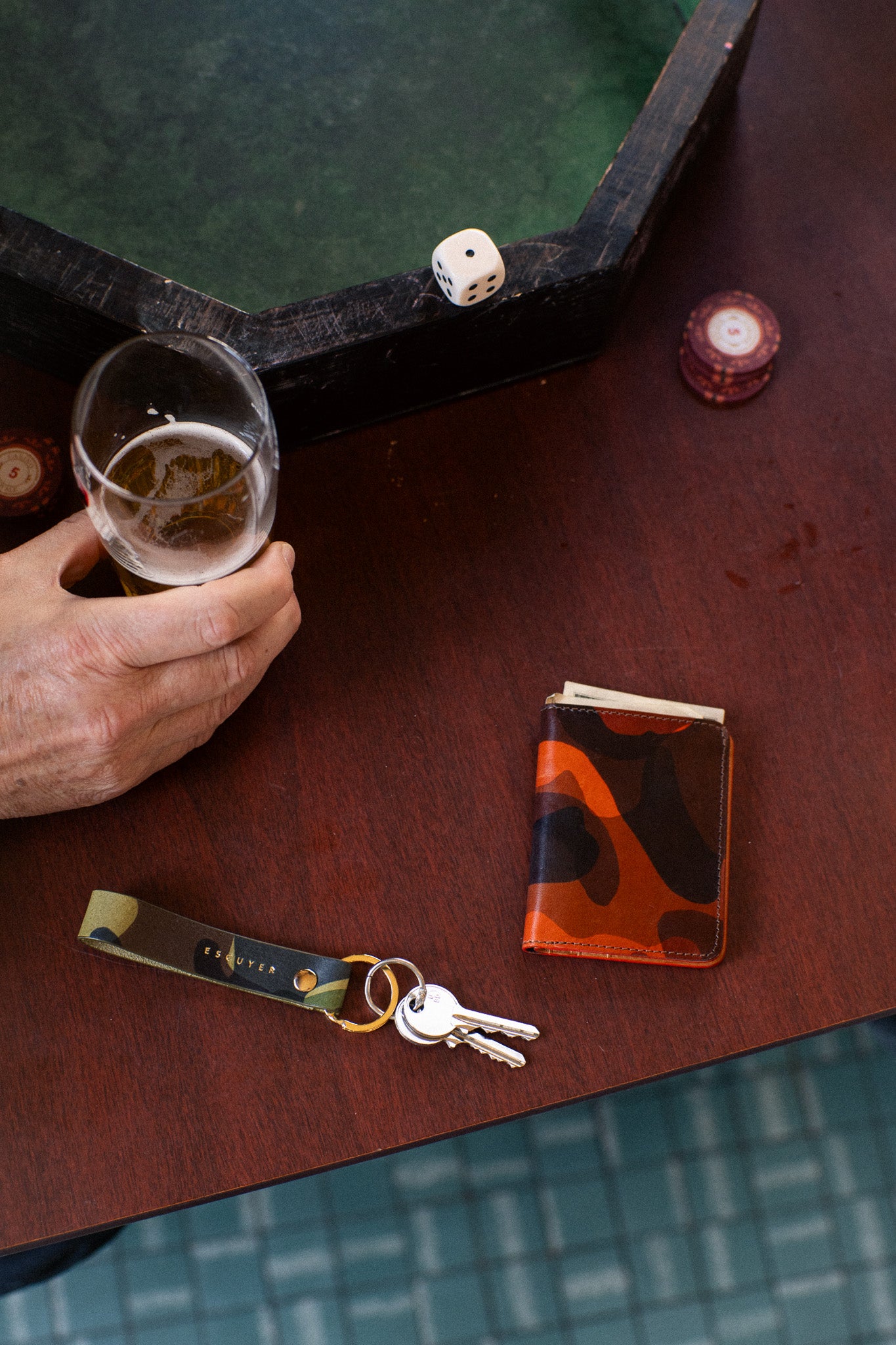 Escuyer camouflage slim leather wallet lifestyle — hand-dyed Italian veg-tan, made in Portugal