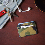 Escuyer camouflage leather cardholder with keys and accessories on wooden surface — lifestyle shot