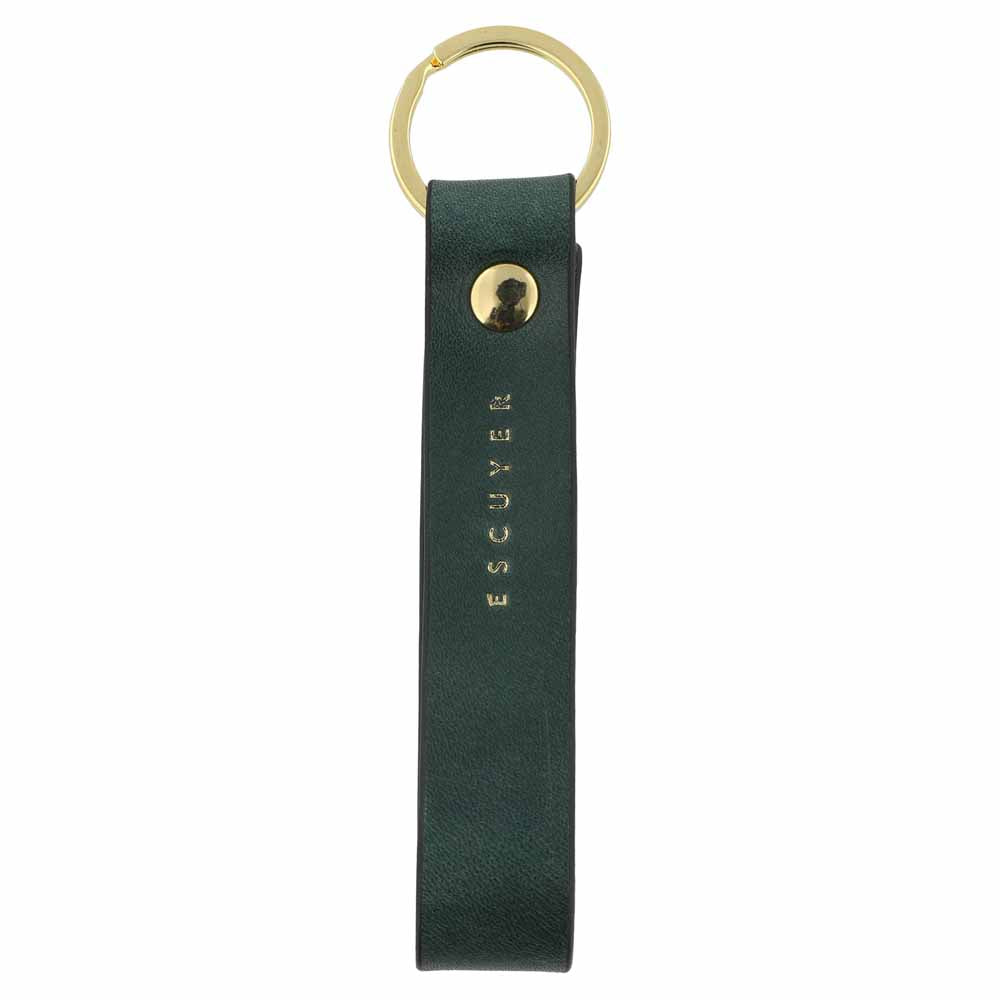 Escuyer green leather keychain — Italian vegetable tanned leather tab with gold metal ring and gold Escuyer logo