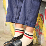 Woman wearing Escuyer striped ankle socks with black loafers — styled for spring summer