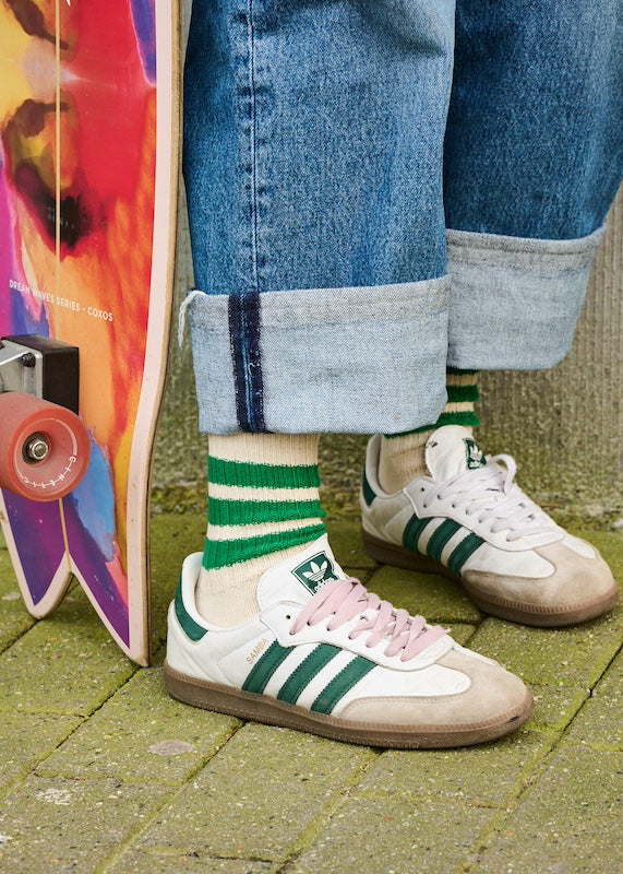 Woman wearing ecru and green striped crew socks by Escuyer, made in Portugal