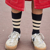 Man wearing Escuyer men's striped crew socks, made in Portugal