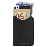 Escuyer black leather card sleeve holding cards and a folded banknote — holds up to 8 cards