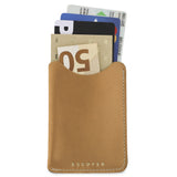 Escuyer natural leather card sleeve holding cards and a folded banknote — holds up to 8 cards