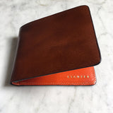 Escuyer light brown and orange billfold wallet showing exterior colour and hand painted edges