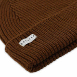 Side view of tobacco brown ribbed merino wool beanie with folded cuff
