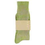 One-of-a-kind men's tie dye crew socks in spring green, hand-dyed, made in Portugal by Escuyer