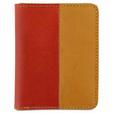 Escuyer orange and mustard slim wallet — vertical colour-block exterior, orange left half, mustard right half