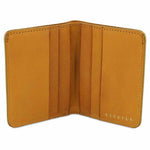 Escuyer mustard slim wallet open — 6 card slots in natural leather interior