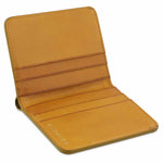 Escuyer mustard slim wallet showing slim profile and hand painted edges