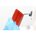 Escuyer light brown and orange billfold wallet — detail of hand painted edges with organic paint